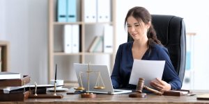 Family law attorney reading about marketing her firm - Family law attorney reading about marketing her firm - Above The Bar - Family law attorney reading about marketing her firm - Above The Bar